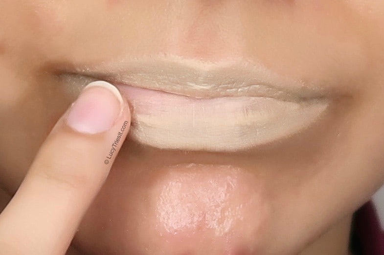 applying foundation as a neutral lip base primer