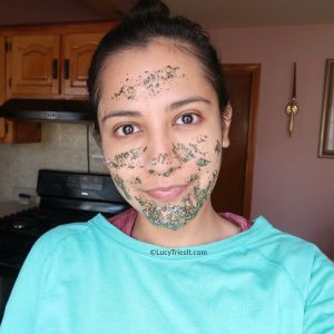 Girl's face wearing a homemade green tea and honey mask