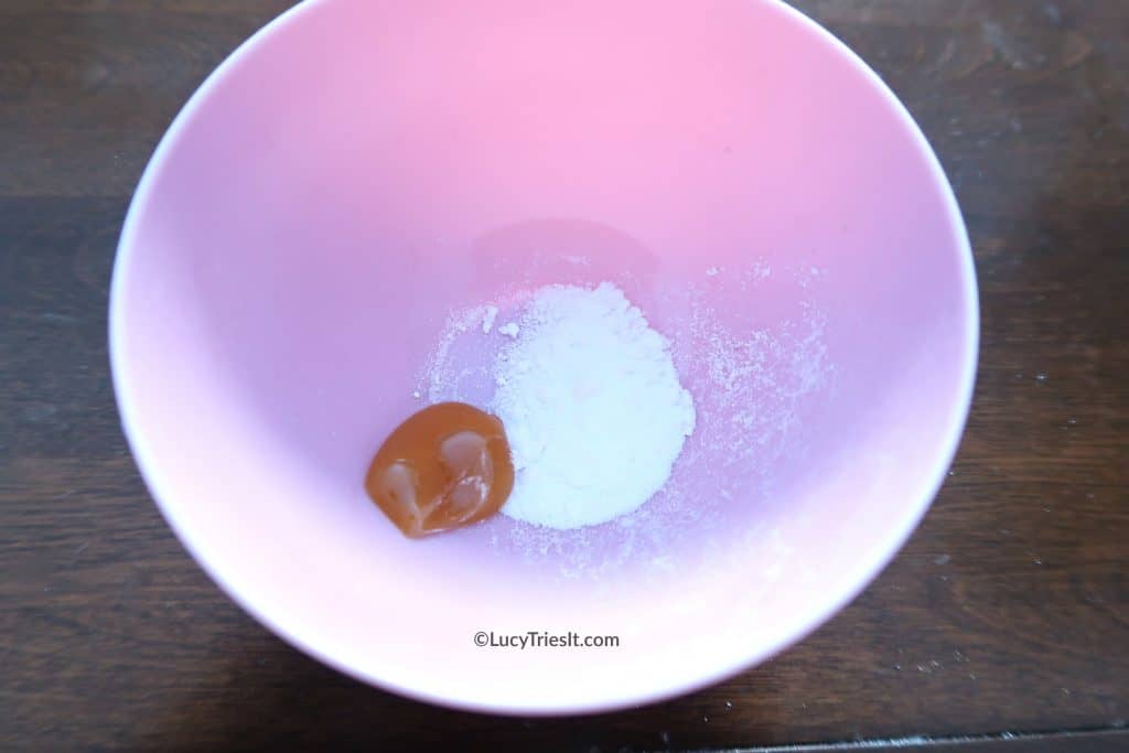 crushed aspirin and honey inside a pink bowl