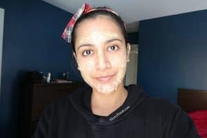 woman with an aspirin face mask for acne