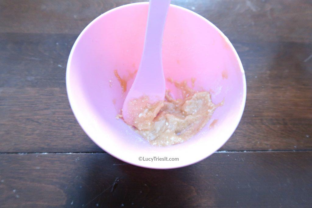 Aspirin and honey face mask in a pink bowl